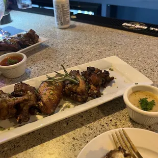 Wings with garlic parmesan sauce on the side.