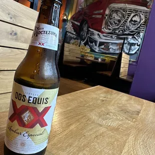 Pretty sweet wall painting and my cerveza.