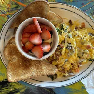 Ham, vegetable and cheese scramble with whole wheat toast and fresh fruit.