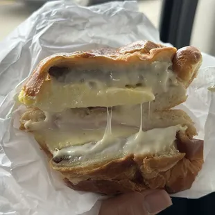 Oooey gooey!! Sausage, Ham, Egg, &amp; Cheese Croissant Breakfast Sandwich.