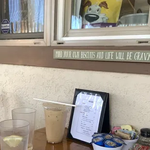 a table with drinks and a menu