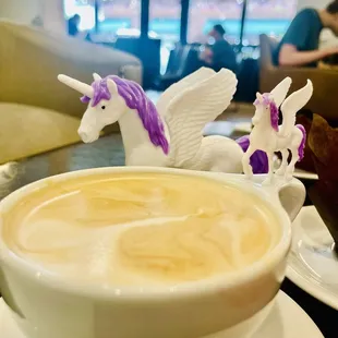 Coffee and tables in background. Unicorns not included we brought those from home