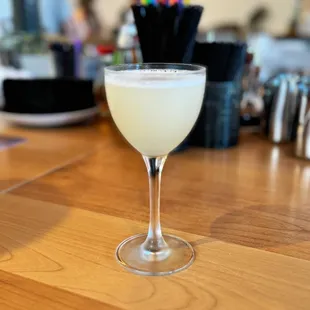 a drink in a glass on a bar