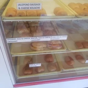 a display case filled with different types of donuts