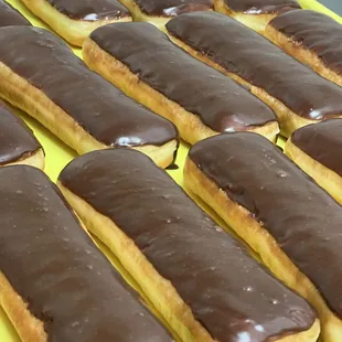 a tray of chocolate covered donuts