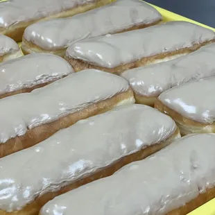 a tray of glazed donuts