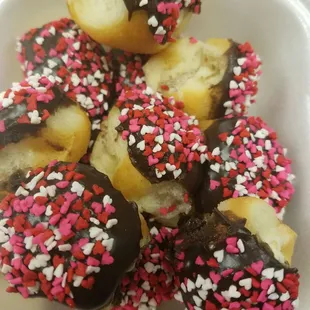 a white container filled with chocolate and sprinkles