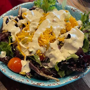 a plate of salad with dressing