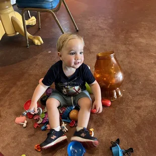 a toddler playing with toys