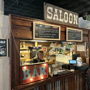 The bar in the room adjacent to the ordering counter