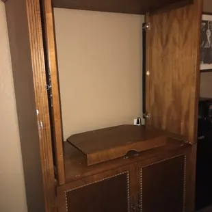 Empty entertainment center (the rooms are pictured with flat screen TV's)