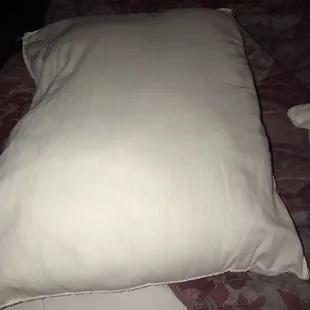 The third pillow, stained and again no pillowcase