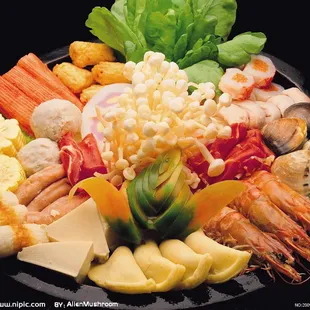 a plate of seafood and vegetables