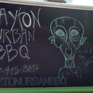 a drawing of a man on a blackboard