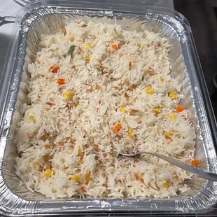 a pan of rice and vegetables