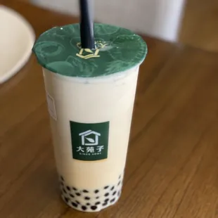 Green milk tea ($4.29), add boba ($0.50)