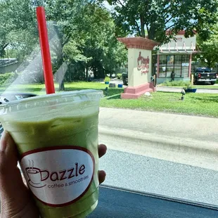 Iced Latte (Matcha) . Dazzle coffee shop in the background
