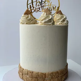 a cake with a happy birthday topper