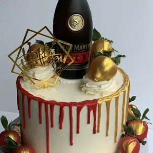 a cake with a bottle of champagne on top