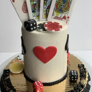 a cake with playing cards on top