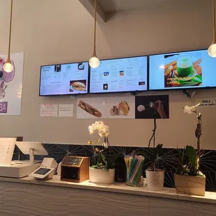a restaurant counter with a variety of menus