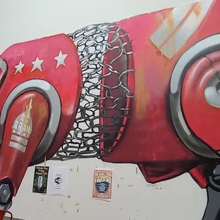 a cow painted on a wall