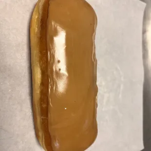 a hot dog covered in caramel