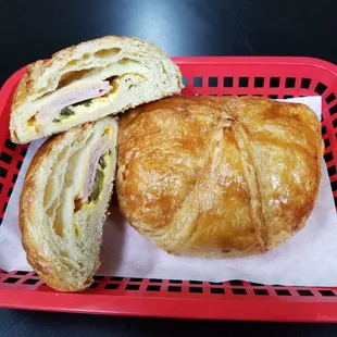 a croissant sandwich in a basket