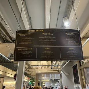 a menu hanging from the ceiling