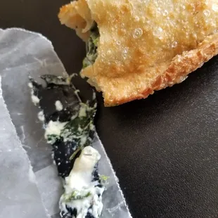 Found a piece of plastic disguised as spinach in my el Greco empanada!!