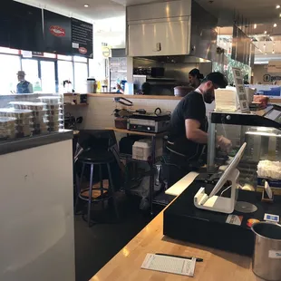 a man preparing food in a restaurant
