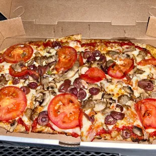 a pizza in a cardboard box