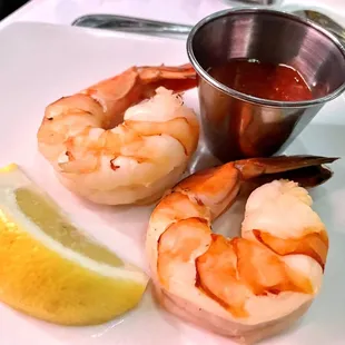 shrimp and a lemon on a plate