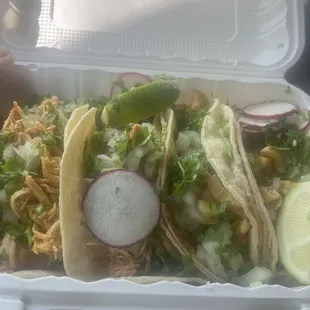 Shredded chicken and fish tacos.