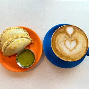 a cup of coffee and a pastry