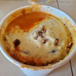 a bowl of soup and a glass of wine