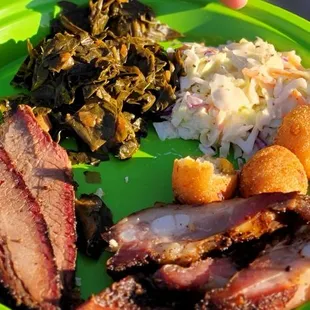 a plate of meat and vegetables