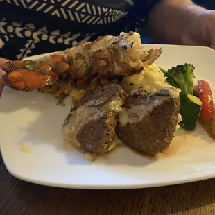 Triple Play.  Steak, lobster tail, crab cakes with mashed potatoes and grilled veggies.  This was half the portion as we split it!