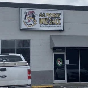 a truck parked in front of a building