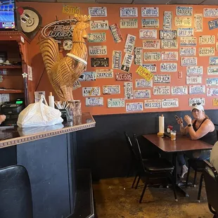 a man sitting at a table in a restaurant