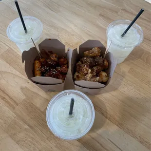 three take out boxes with drinks