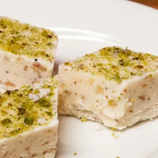 a white plate with three pieces of it