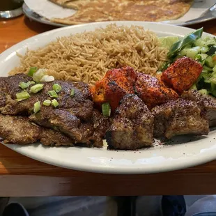 3 Kabob platewith brown rice and cucumbers from de Afghanan in Tracy