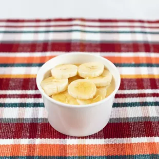 Homemade Rice Pudding topped with fresh Banana and honey