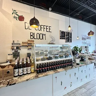 Coffee bar, dessert case, and register.