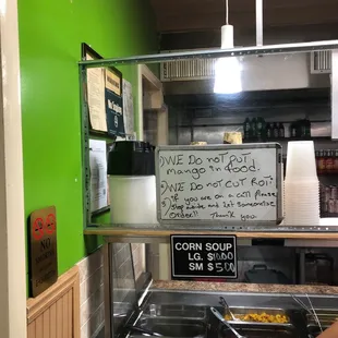 One of many rude signs you'll encounter at this hole in a wall