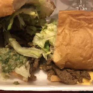 Carne Asada torta- meat, cheese, guacamole, and lettuce. Was very good. Meat is juicy and tasty