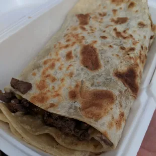 Carne asada burrito. Comes with guac and sour cream normally. Tasty tasty tasty