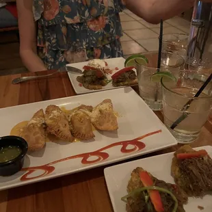 Tapas tostones with ropa vieja, empanadas