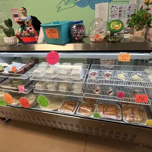 a display case with a variety of pastries